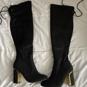 Black heeled boots. Never worn.